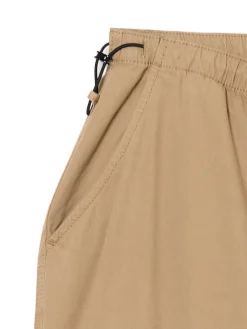 Beżowe spodnie parachute