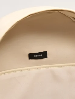 Beżowy plecak z metalowymi detalami