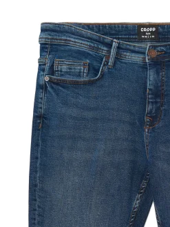 Granatowe jeansy slim