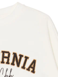 Kremowa bluza z naszywkami