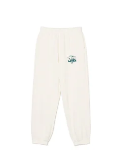 Kremowe dresowe joggery z naszywką