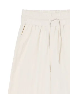 Kremowe spodnie baggy z wysokim stanem